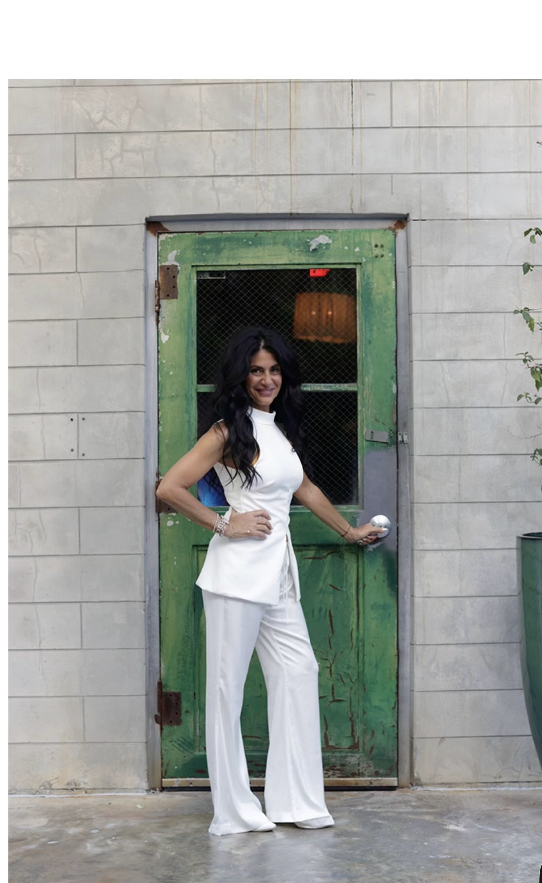 Stefania Sorrenti beside a green door